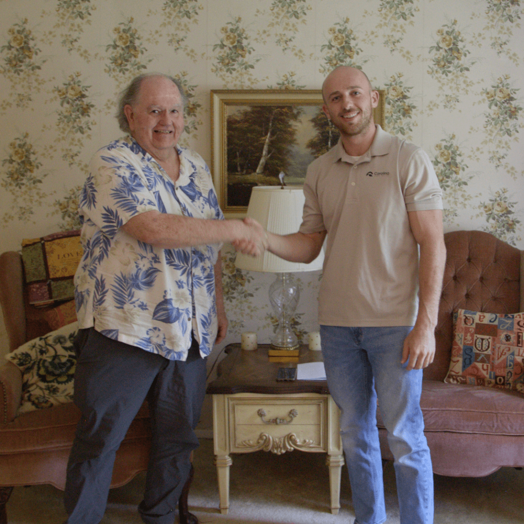 Bill Osteen shaking hands with Nathan